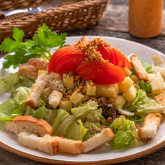 Chicken salad with vegetables, cheese and croutons
