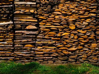 Neatly stacked firewood. Preparation for the winter