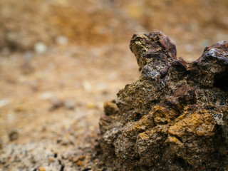 Iron ore deposits. Rusty stone with iron elements