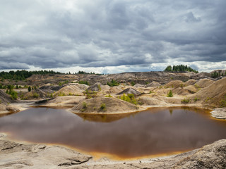 Fototapeta na wymiar The lake is red because of deposits of refractory clay
