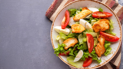 Chicken salad with fresh vegetables . Copy space. Top view