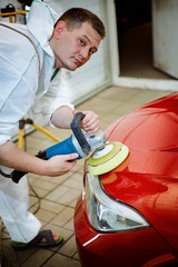 Preparing the car for sale at a service station.
