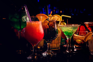 Different cocktails at the bar in a nightclub party