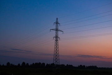 Fototapeta premium electric poles on the background of sunrise