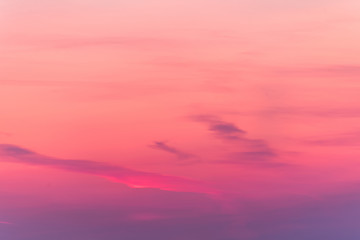 sunset background. sky with soft and blur pastel colored clouds. sunshine through the gradient cloud on the beach resort. nature. sunrise.  peaceful morning