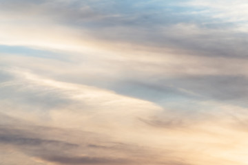 sunset background. sky with soft and blur pastel colored clouds. sunshine through the gradient cloud on the beach resort. nature. sunrise.  peaceful morning
