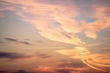 sunset background. sky with soft and blur pastel colored clouds. sunshine through the gradient cloud on the beach resort. nature. sunrise.  peaceful morning