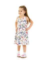 A cheerful little girl is dancing.