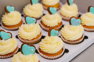 Cupcakes with cream for a sweet table for a wedding