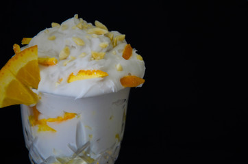 Delicious ice cream. Plombir. Ice cream with nuts and oranges. Cool dessert.