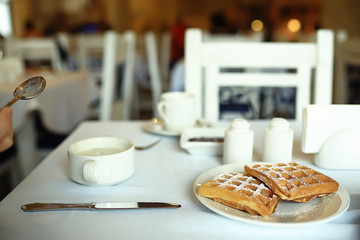 cup of coffee for breakfast in a cafe / serving cup of coffee in modern interior, a European breakfast