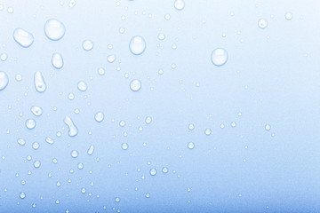 Drops of water on a color background. Selective focus. Blue. Toned