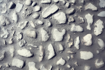 old stone pavement background / abstract pavement, large cobblestones, old road texture