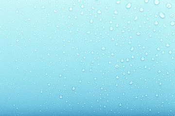 Drops of water on a color background. Selective focus. Blue. Toned