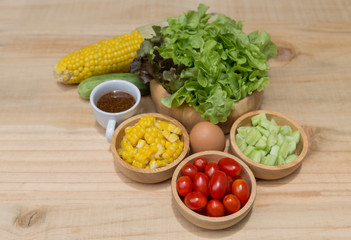 Fresh vegetable in wooden bowl with Japanese salad dressing, healthy diet food concept