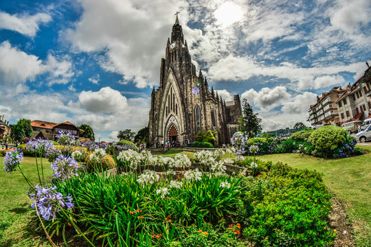 Photo of the cathedral of the city of Canela in Rio Grande do Sul. In the image of a summer day there a lot of tourists.