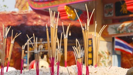 Video 4k of close-up Incense sticks burning with smoke