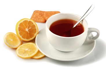 Hot drink with a lemon and cookies