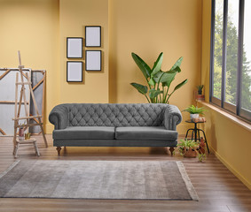 Modern yellow living room, black and white classic sofa, easel and painting style, frame vase of plant and interior decoration.