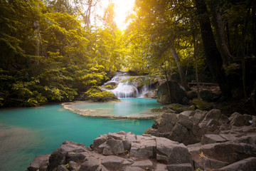 The Erawan Waterfalls in Kanchanaburi, Thailand during sunshine.