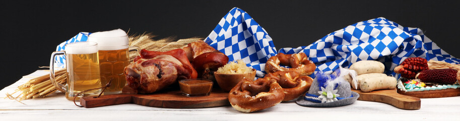 Traditional German cuisine, Schweinshaxe roasted ham hock. Beer, pretzels and various Bavarian specialties. Oktoberfest background