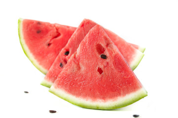 Slices of juicy ripe red watermelon on a white background. Fresh watermelon juice. Cocktails and soft drinks with watermelon.