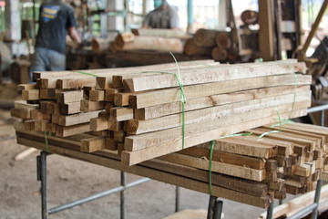 Pile of lumber woods in warehouse at wood factory or sawmill