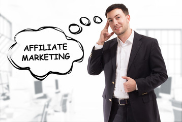 Business, technology, internet and network concept. The young businessman comes up with the keyword: Affiliate marketing