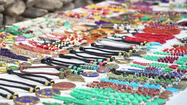 Traditional Homemade Bracelets and Necklaces on Open Village Market in Ladakh Region, India. Cinematic Slowmotion