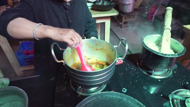 Cooking Chutagi Chhu Tagi in Local Restaurant, Traditional Meal of Ladakh, Under Himalayas Region. Adding Salt Slowmotion