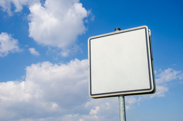 Sign on blue sky background.