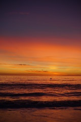 VIBRANT SUNSET WITH SURFERS SPORTS