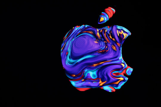 The Apple Logo Is Shown During Screensaver On Display, Düsseldorf, Germany - August 23, 2019