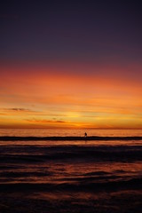 VIBRANT SUNSET WITH SURFERS SPORTS