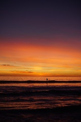 VIBRANT SUNSET WITH SURFERS SPORTS