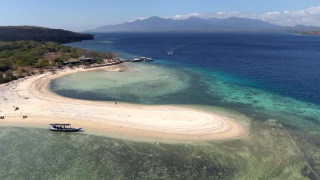 Aerial view of Menjangan Island off the coast of Bali, Indonesia. Menjangan is situated in the Bali Barat National Park, a protected marine reserve home to pristine coral reefs and rich marine life.