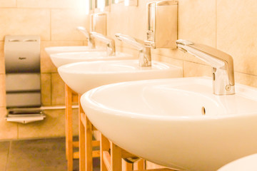 The sinks in a modern public rest room.