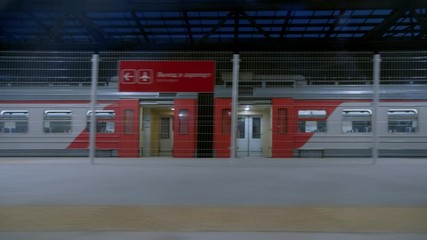 Train leaves empty station platform at airport