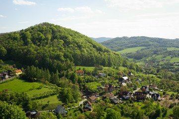 Fototapeta na wymiar Stramberk, Czech Republic / Czechia - aerial shot of village and Kotouc hill. Green plants and trees during summer