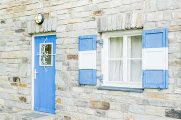 Fototapeta na wymiar brick wall with wooden window and door Blue