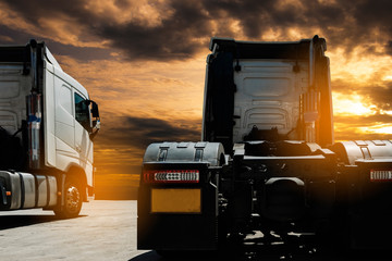 Semi TrailerTrucks Parked with The Sunset Sky. Shipping Trucks. Engine Diesel Trucks. Lorry Tractor. Industry Freight Trucks Logistics Cargo Transport.  © Siwakorn1933