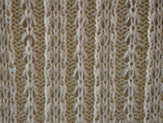  White knitting wool texture background with handmade fancy knit.