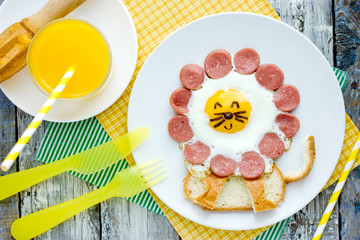 Fun idea for kids breakfast - fried egg with sausage and toast shaped cute lion