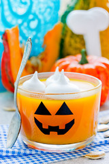 Pumpkin orange jelly or panna cotta in glass - fun and healthy idea for Halloween party dessert for kids