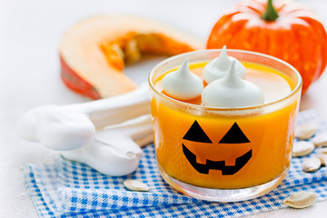 Pumpkin orange jelly or panna cotta in glass - fun and healthy idea for Halloween party dessert for...