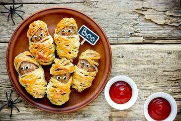 Halloween mummies - meatballs wrapped in dough with funny eyes , funny idea for halloween party...