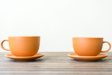 cup of coffee on wooden table
