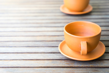 cup of coffee on wooden table