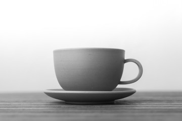 cup of coffee on wooden table
