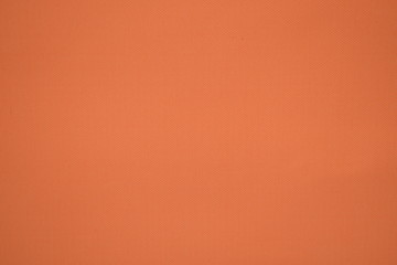 Focus peach color background, fabric texture for warm elegant background.